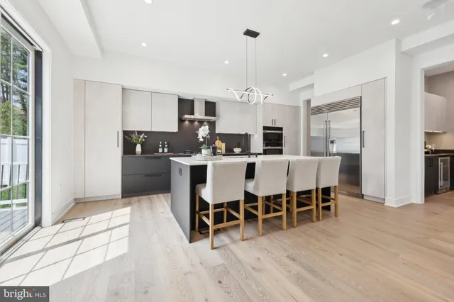 a view of a livingroom with furniture window and wooden floor