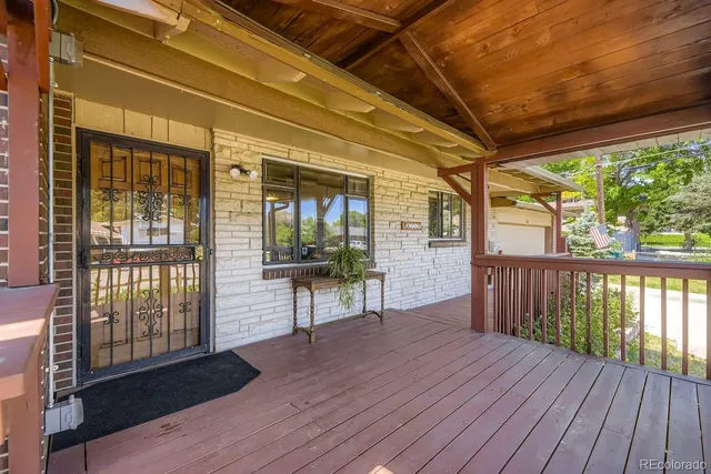 a view of a porch with wooden floor
