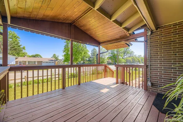 a view of balcony with wooden floor