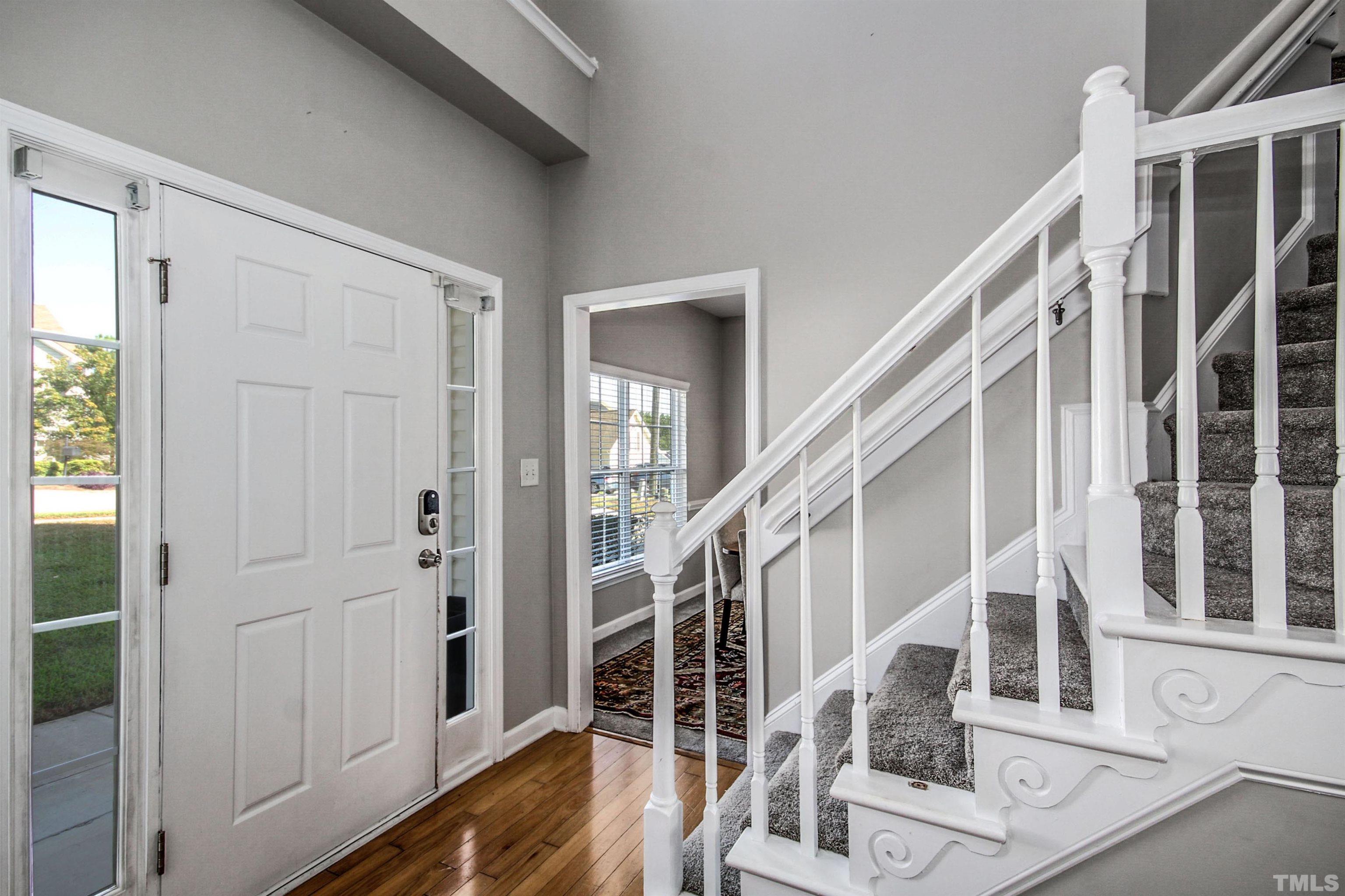 2218 Flowing Drive Raleigh, NC 27610 - Photo 2 of 27 a view of entryway and hall with wooden floor