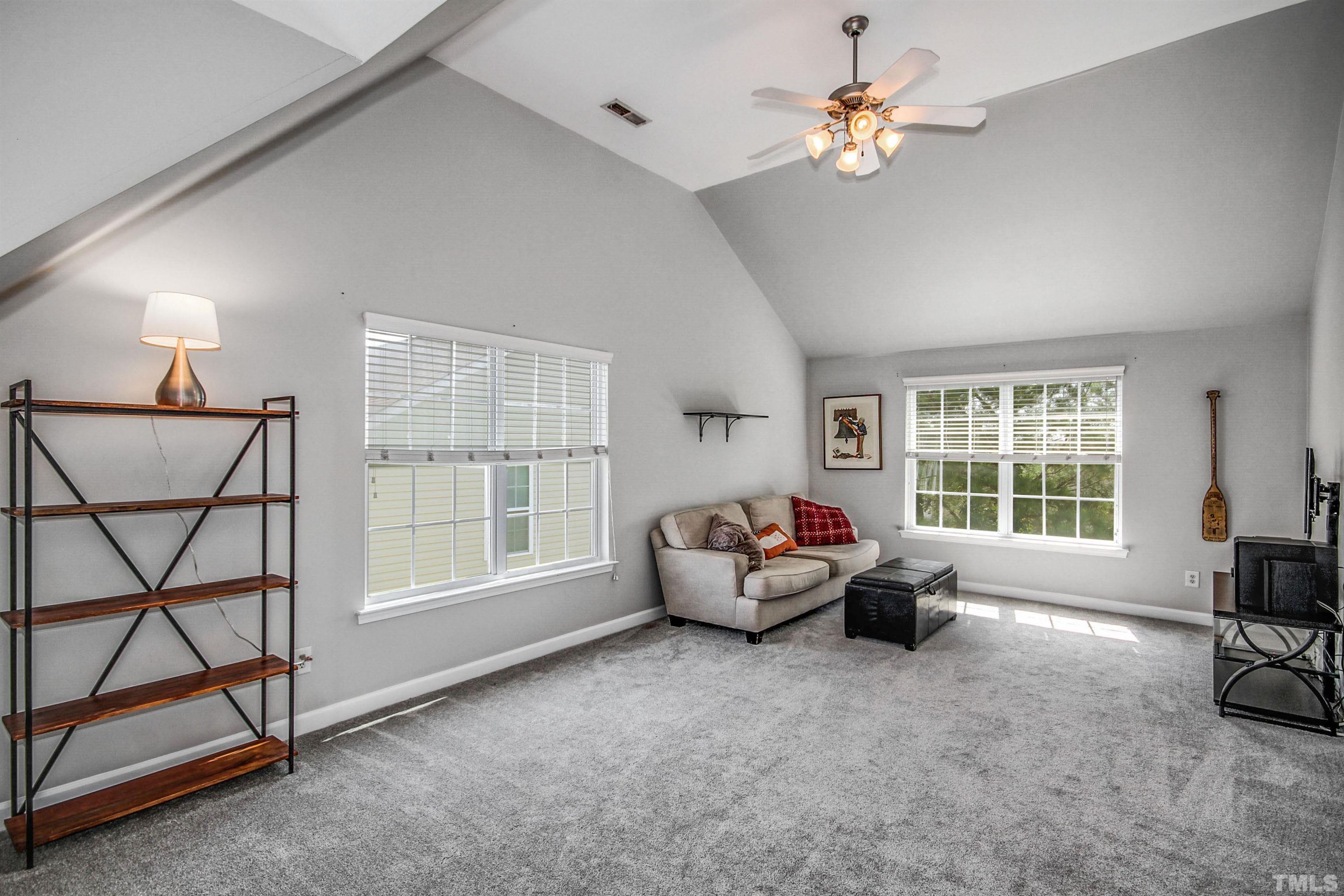 2218 Flowing Drive Raleigh, NC 27610 - Photo 20 of 27 a living room with furniture and a window