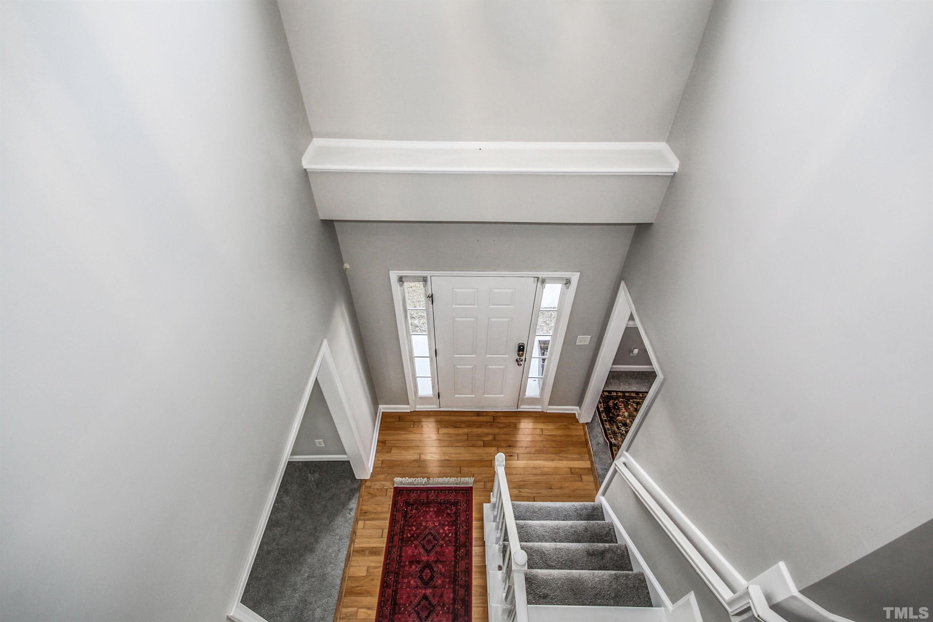 2218 Flowing Drive Raleigh, NC 27610 - Photo 3 of 27 a view of entryway with wooden floor