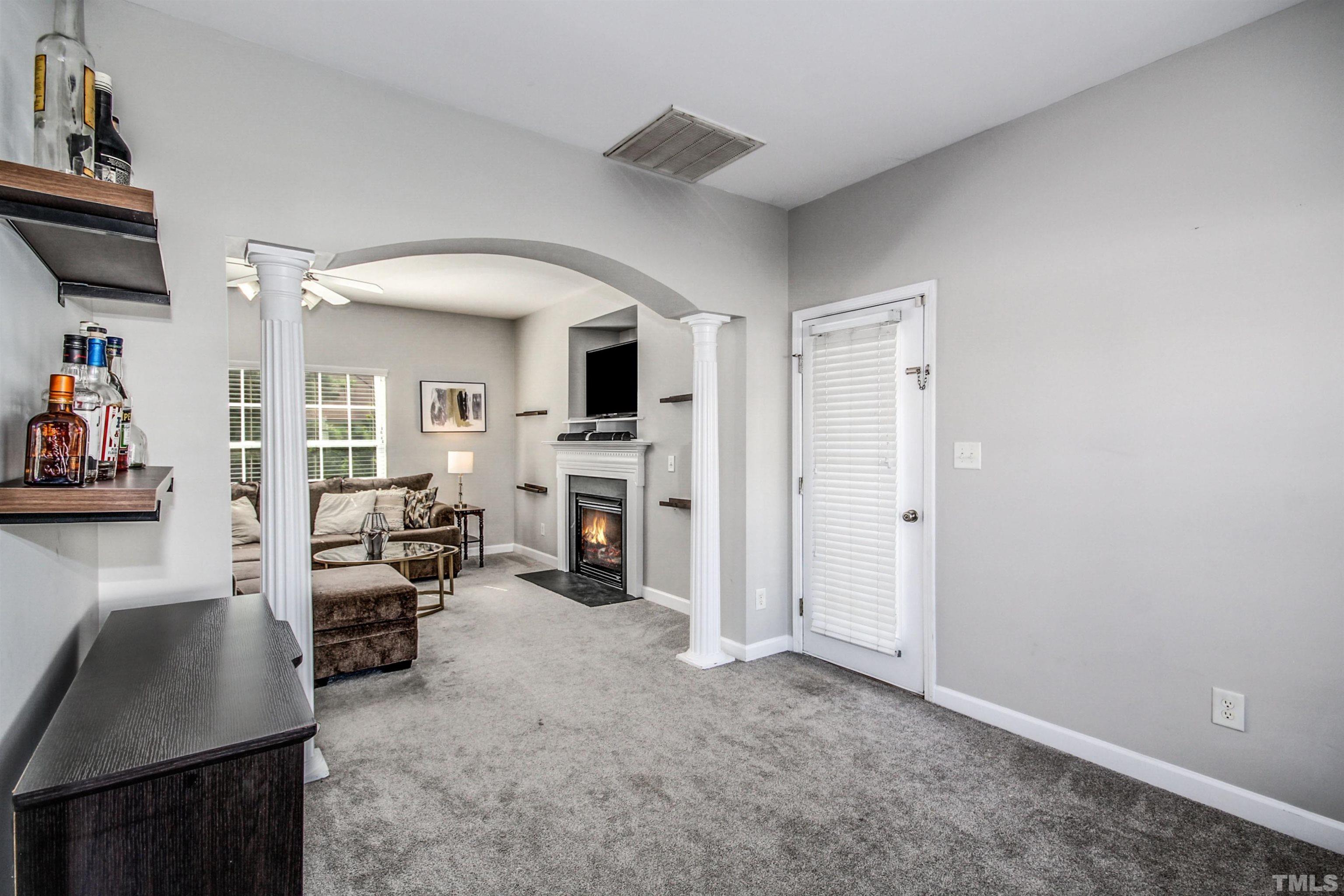 2218 Flowing Drive Raleigh, NC 27610 - Photo 4 of 27 a living room with furniture and a fireplace