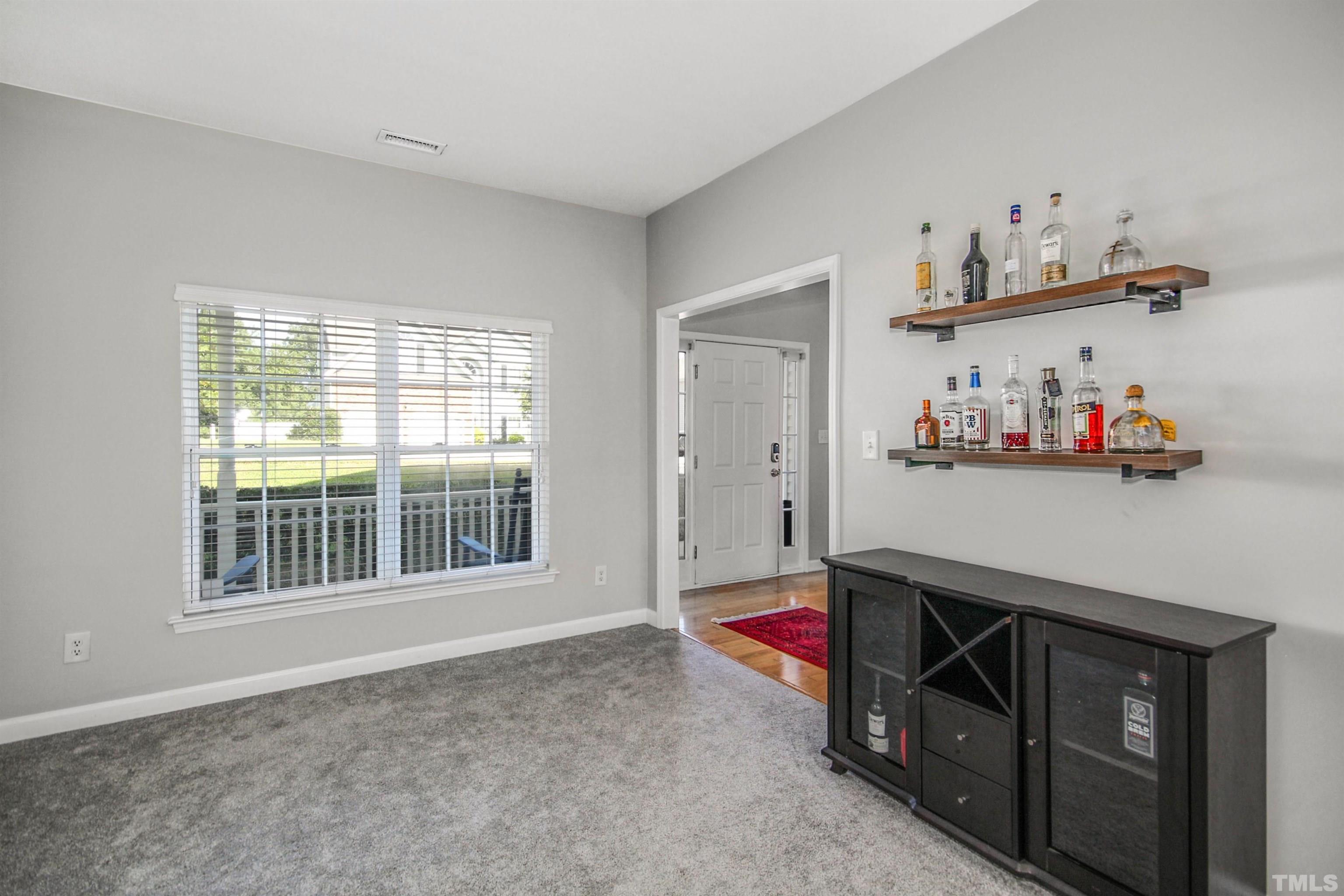 2218 Flowing Drive Raleigh, NC 27610 - Photo 5 of 27 a room with toys and a window