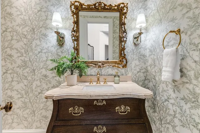 a view of bathroom with a sink and a mirror