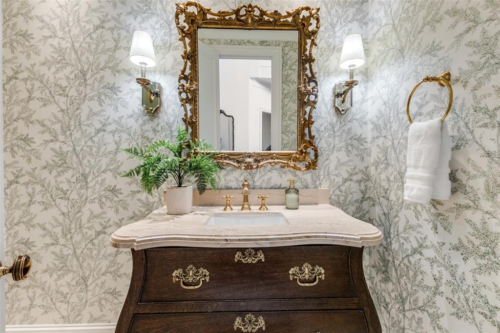 14828 Bellbrook Drive Addison, TX 75254 - Photo 11 of 36 a view of bathroom with a sink and a mirror