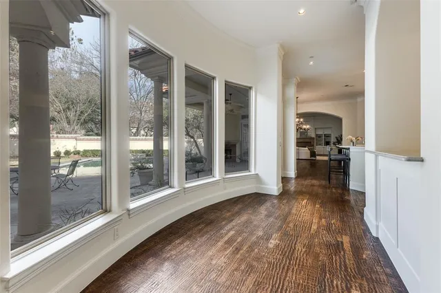 a view of a room with wooden floor and a balcony
