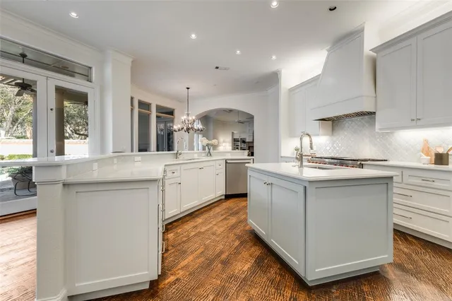 a kitchen with sink cabinets and window
