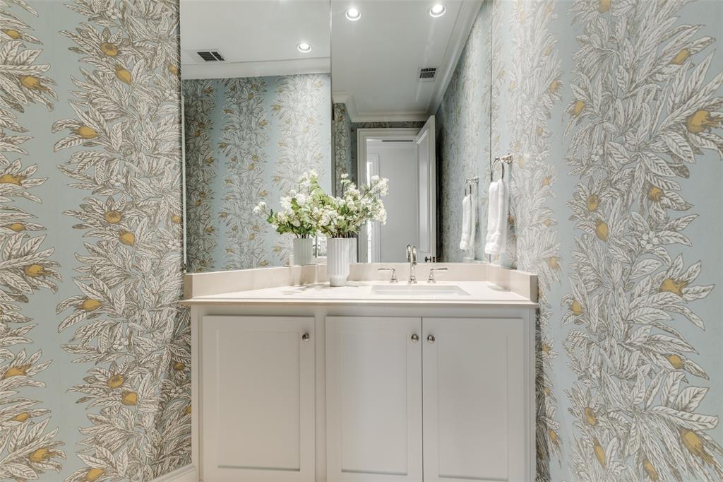 14828 Bellbrook Drive Addison, TX 75254 - Photo 19 of 36 a bathroom with a sink and a mirror