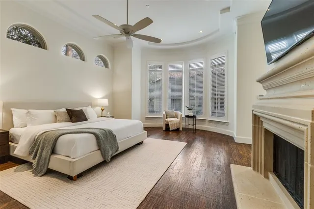 a spacious bedroom with a bed and a couch