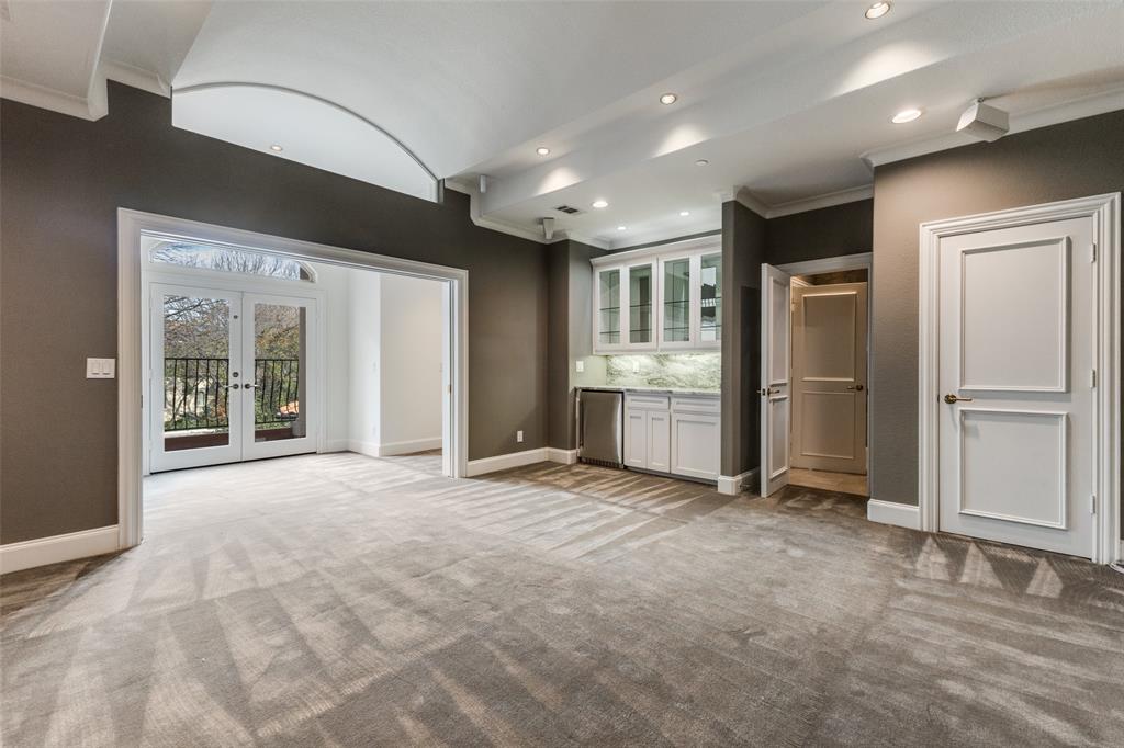 14828 Bellbrook Drive Addison, TX 75254 - Photo 27 of 36 a view of an empty room with a fireplace