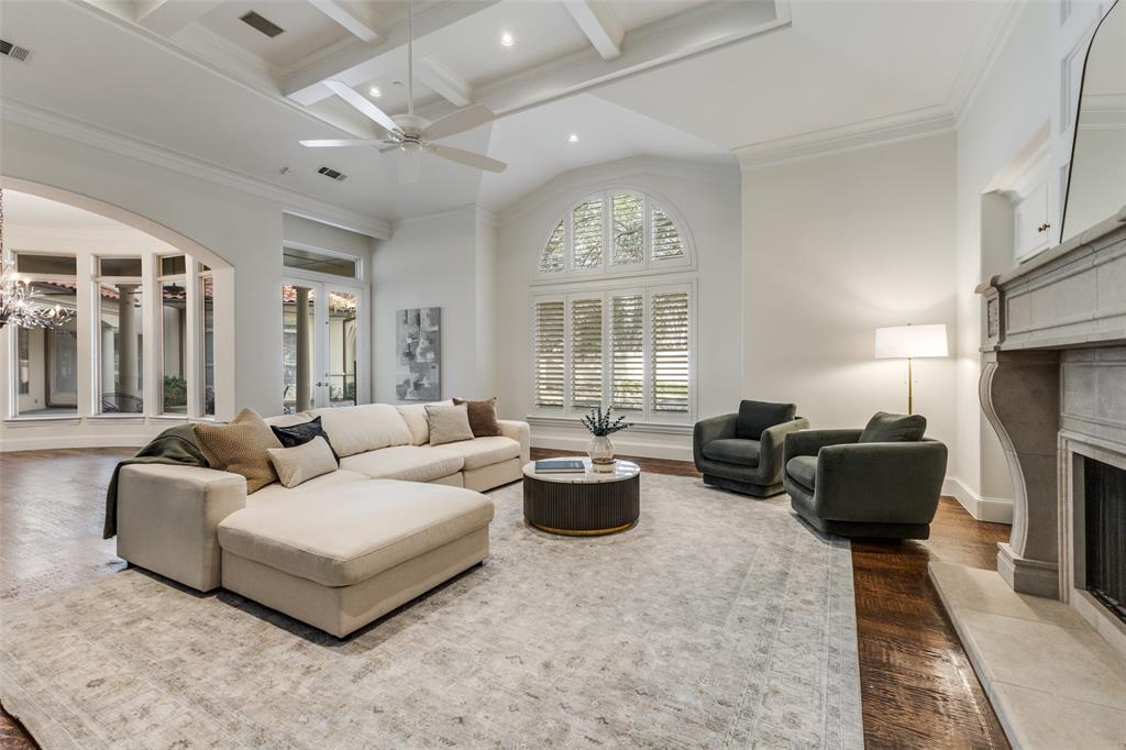 14828 Bellbrook Drive Addison, TX 75254 - Photo 7 of 36 a living room with furniture and a fireplace