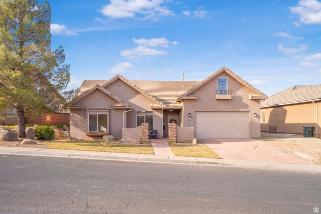1570 South Rio Virgin Drive Washington, UT 84780 - Photo 71 of 71 Traditional home featuring a tile roof, stucco siding, and concrete driveway