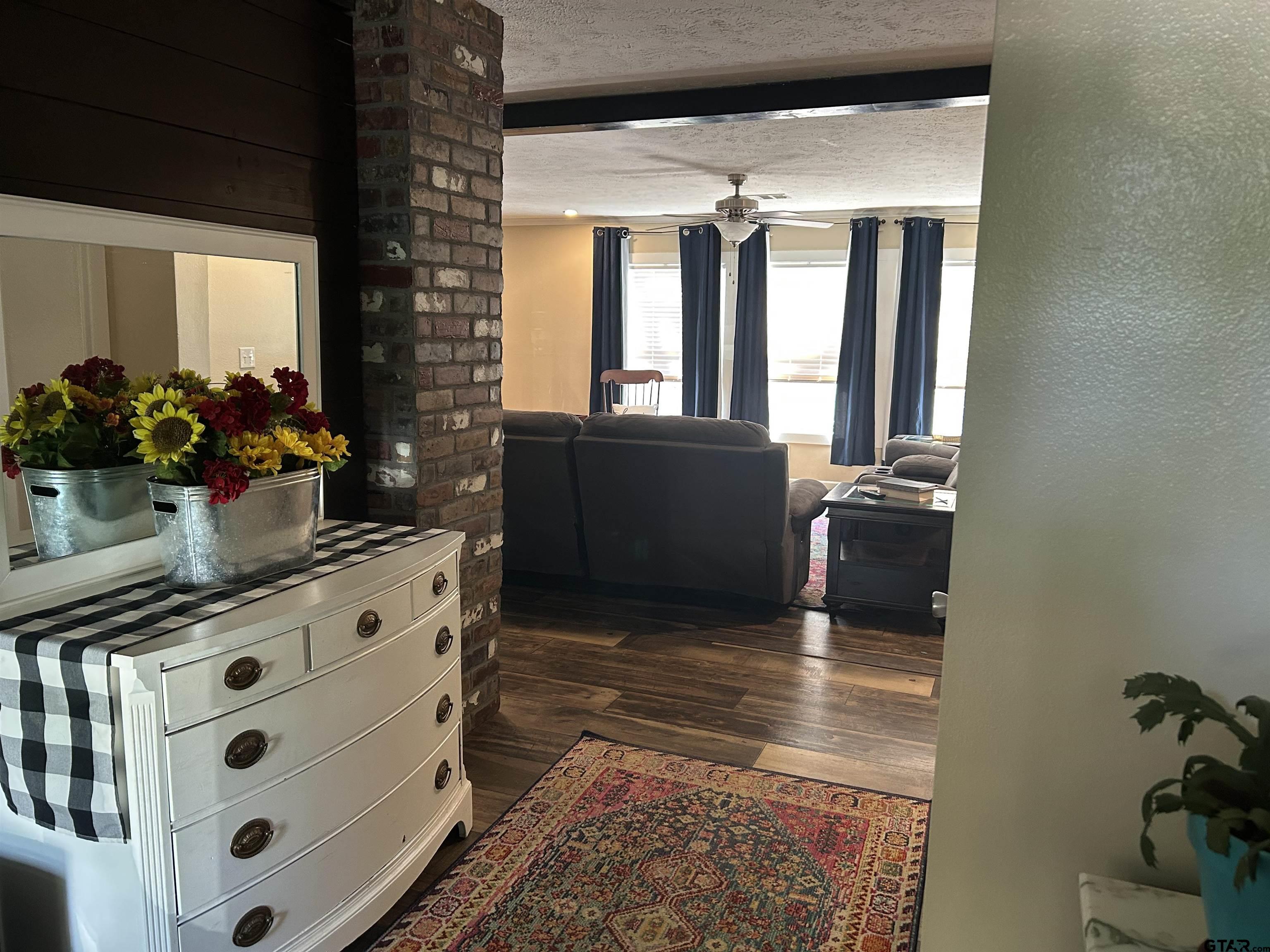15210 County Road 285 Tyler, TX 75707 - Photo 16 of 33 a kitchen with windows and flowers