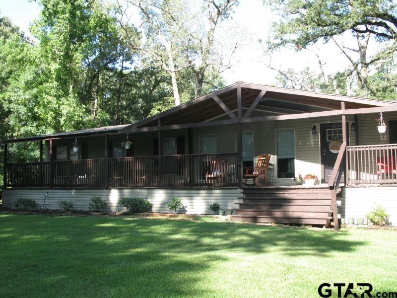 15210 County Road 285 Tyler, TX 75707 - Photo 3 of 33 a front view of house with yard patio and green space