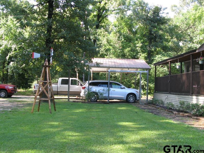 15210 County Road 285 Tyler, TX 75707 - Photo 6 of 33 a view of outdoor space with deck and tree