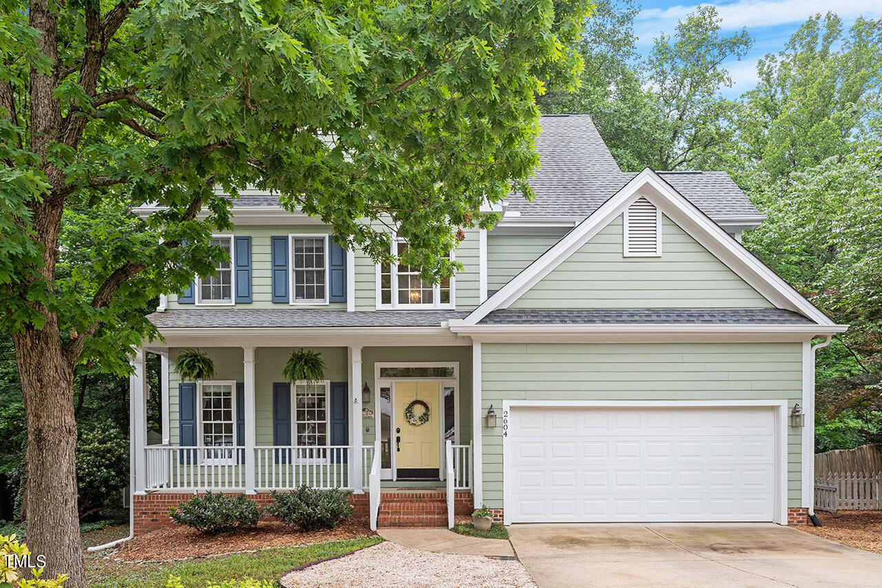 2604 Clerestory Place Raleigh, NC 27615 - Photo 1 of 37 a view of front of a house with plants and large tree