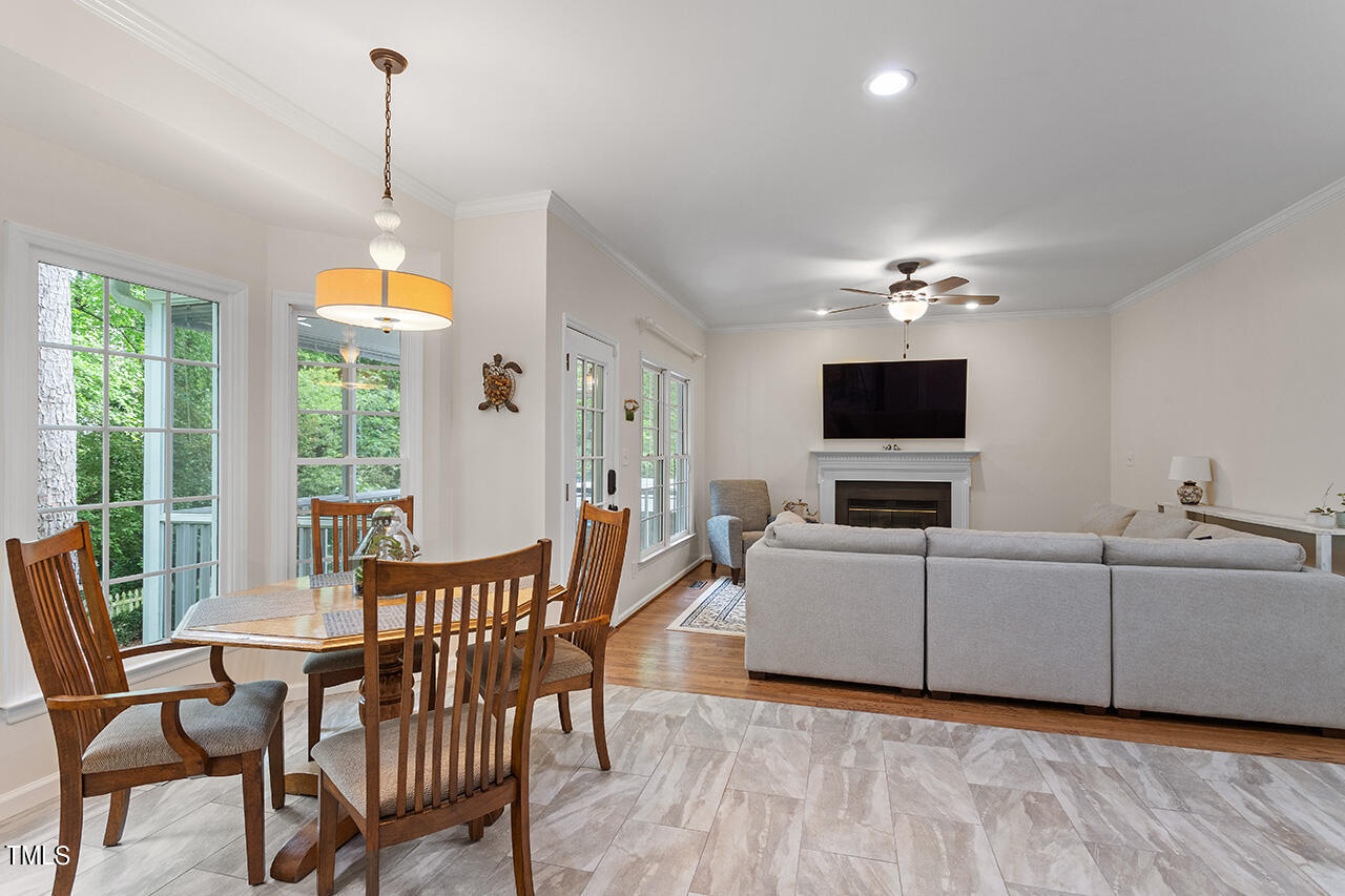 2604 Clerestory Place Raleigh, NC 27615 - Photo 22 of 37 a living room with furniture and a flat screen tv