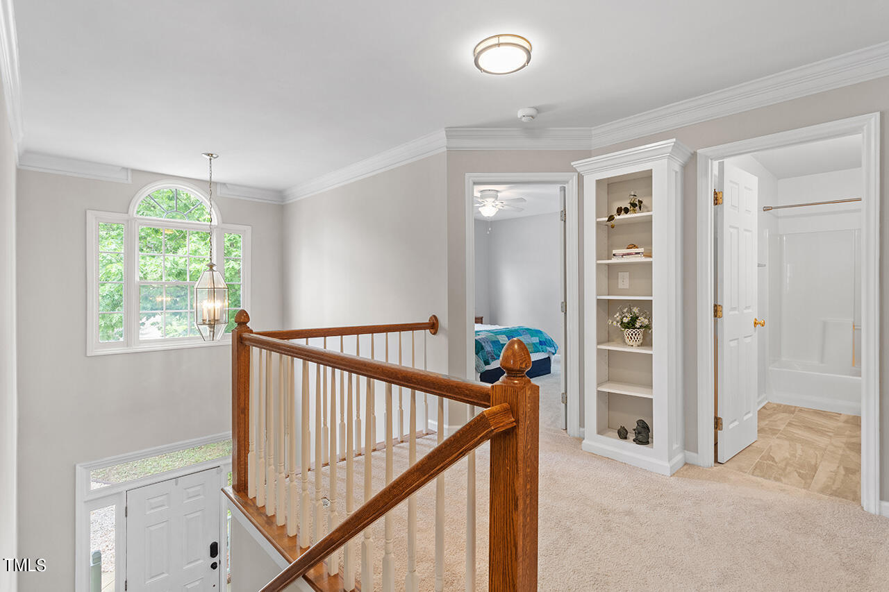2604 Clerestory Place Raleigh, NC 27615 - Photo 25 of 37 a view of a hallway with a window and a livingroom