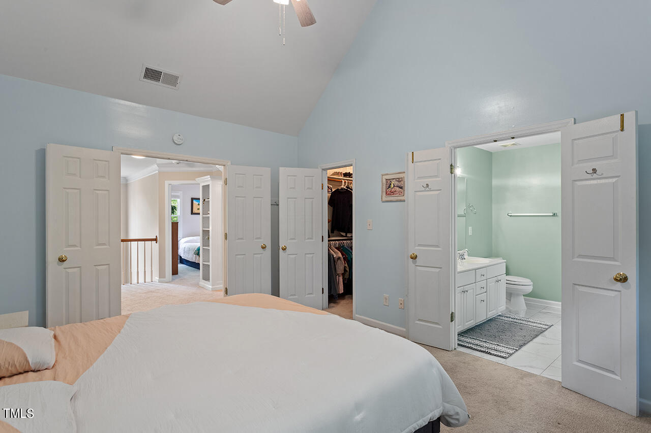 2604 Clerestory Place Raleigh, NC 27615 - Photo 28 of 37 a bedroom with a bed and closet