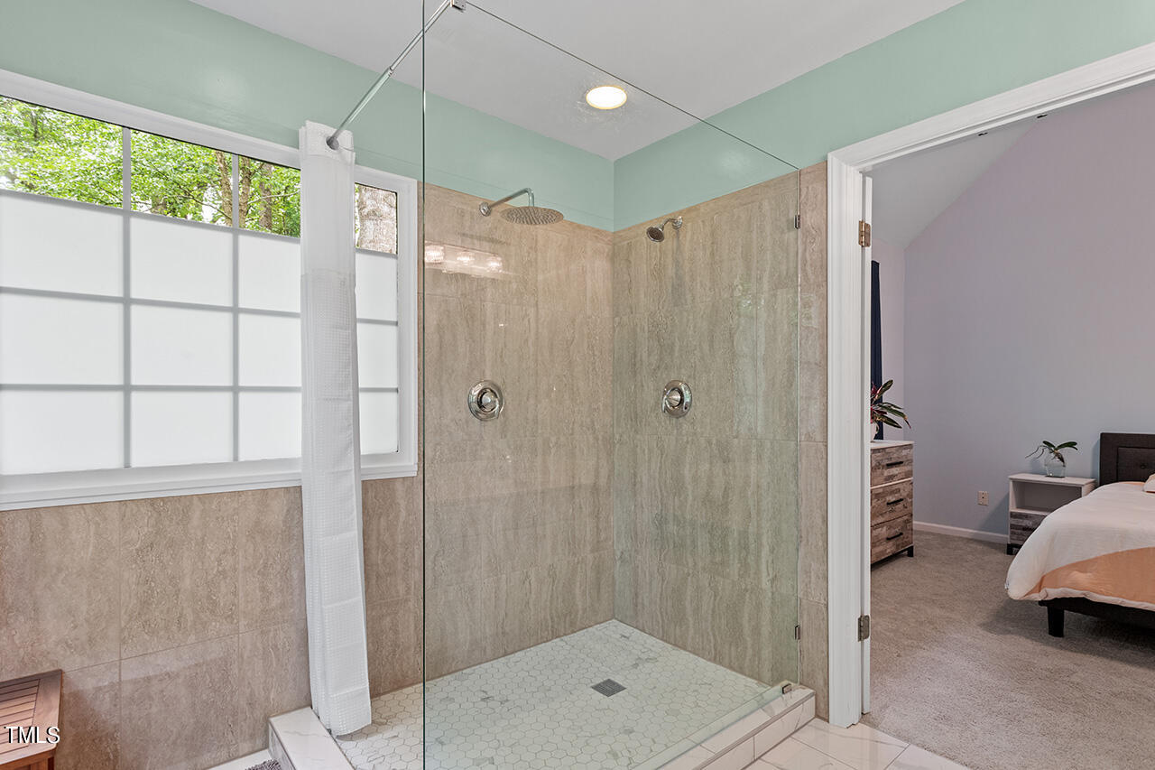 2604 Clerestory Place Raleigh, NC 27615 - Photo 31 of 37 a bathroom with a shower and a sink