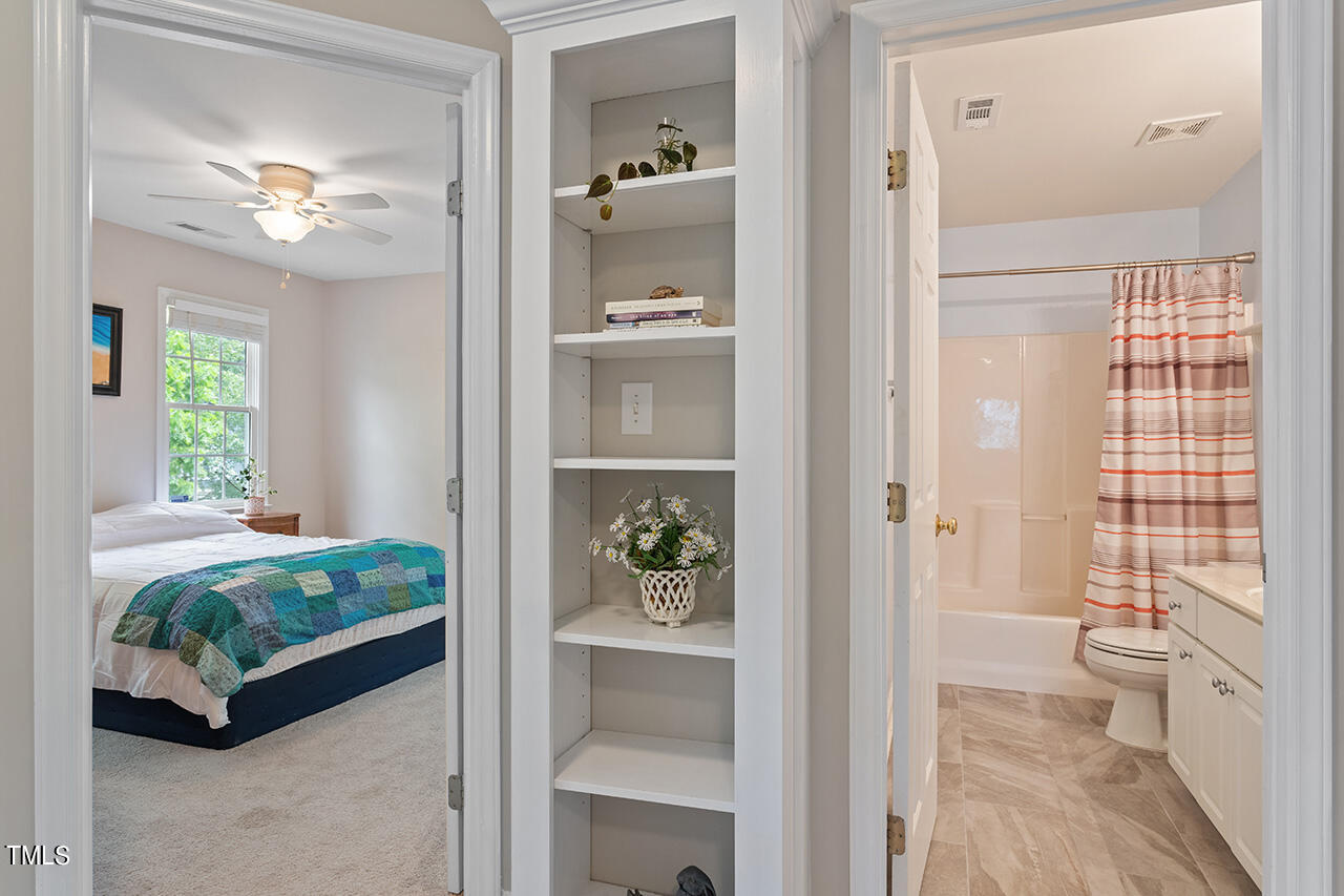 2604 Clerestory Place Raleigh, NC 27615 - Photo 32 of 37 a bedroom with a bed and balcony view