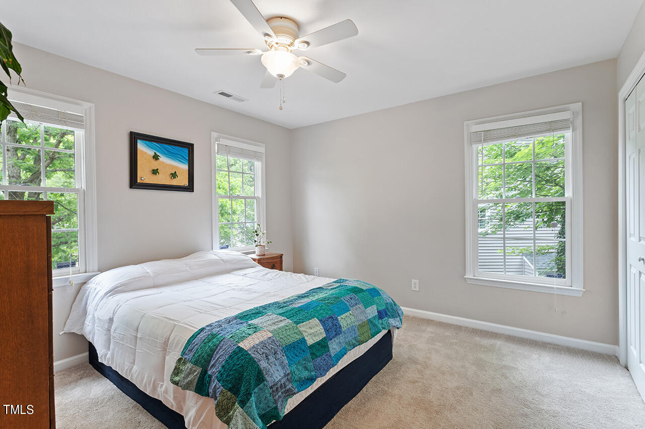 2604 Clerestory Place Raleigh, NC 27615 - Photo 34 of 37 a bedroom with a bed and a window