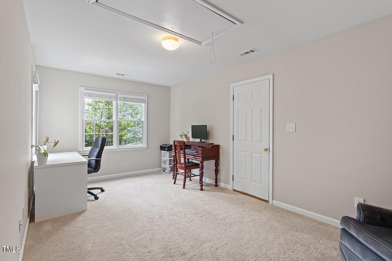 2604 Clerestory Place Raleigh, NC 27615 - Photo 36 of 37 a work room with furniture and a window