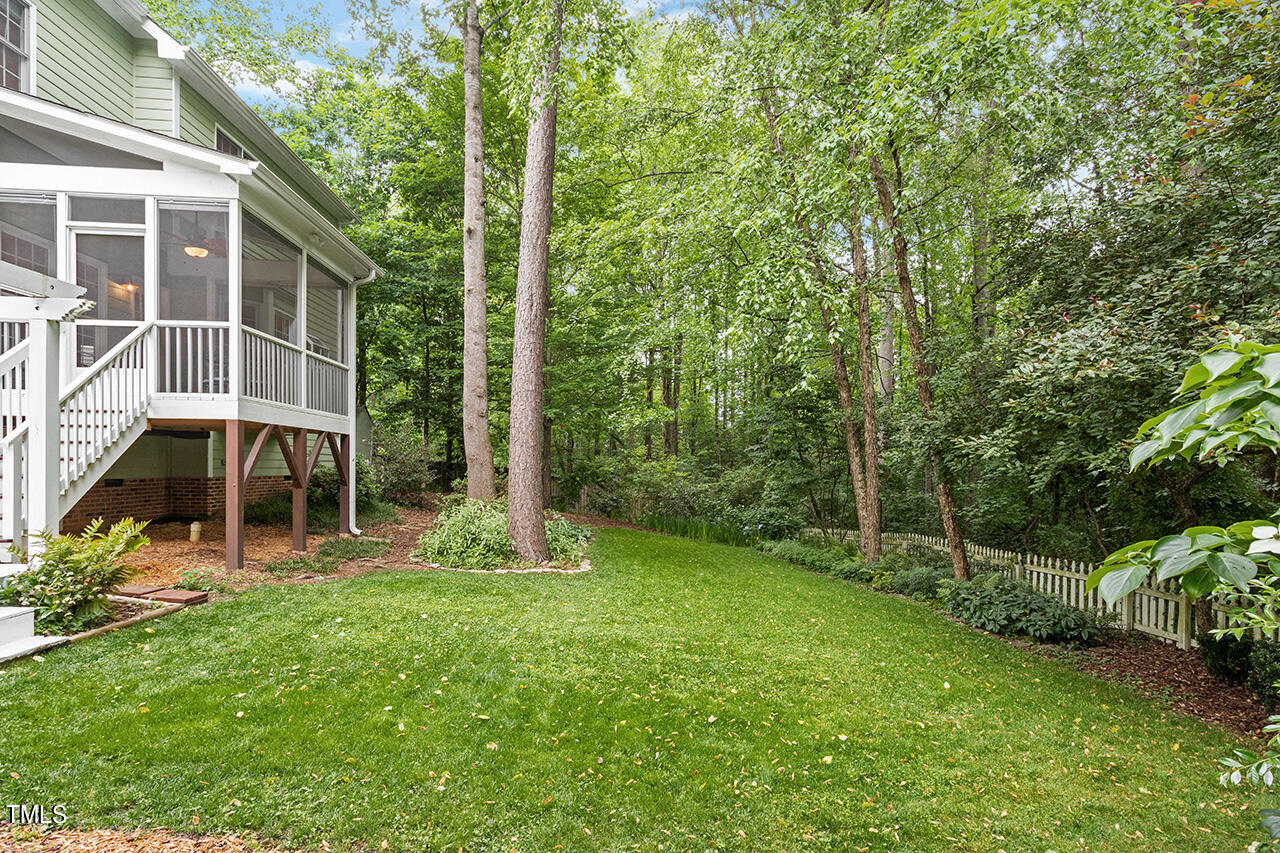 2604 Clerestory Place Raleigh, NC 27615 - Photo 7 of 37 a view of a backyard with plants and large trees