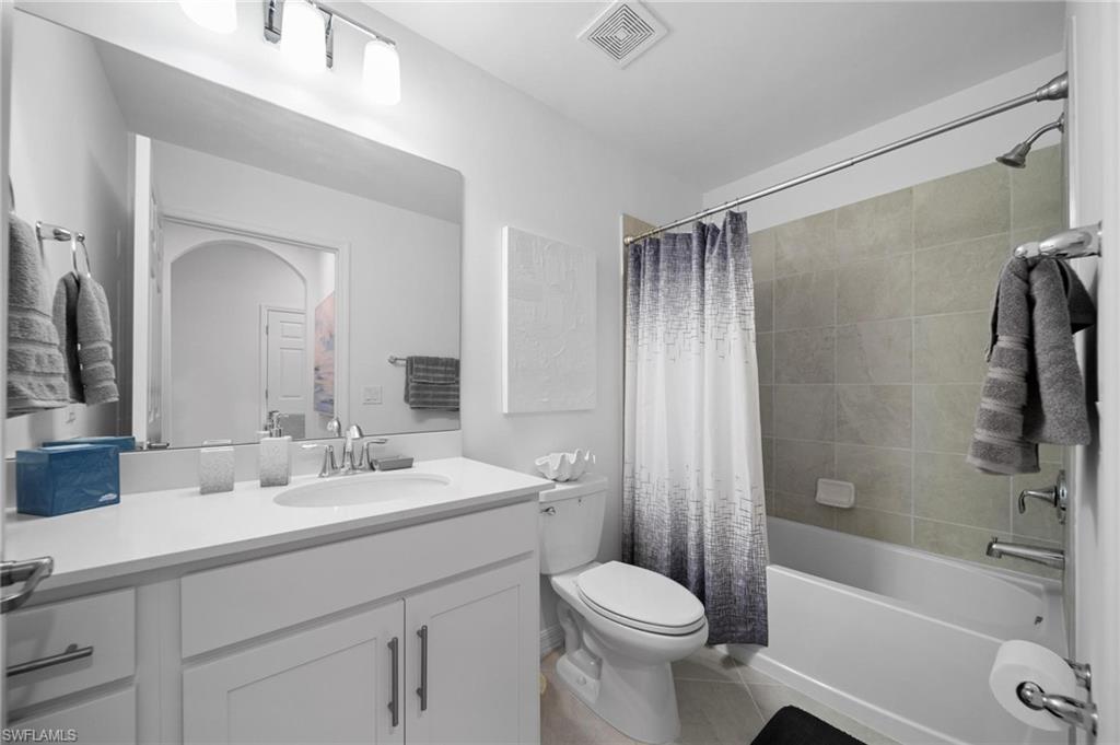 43997 Boardwalk Loop, Unit 1837 Babcock Ranch, FL 33982 - Photo 19 of 26 a bathroom with a sink a toilet and shower