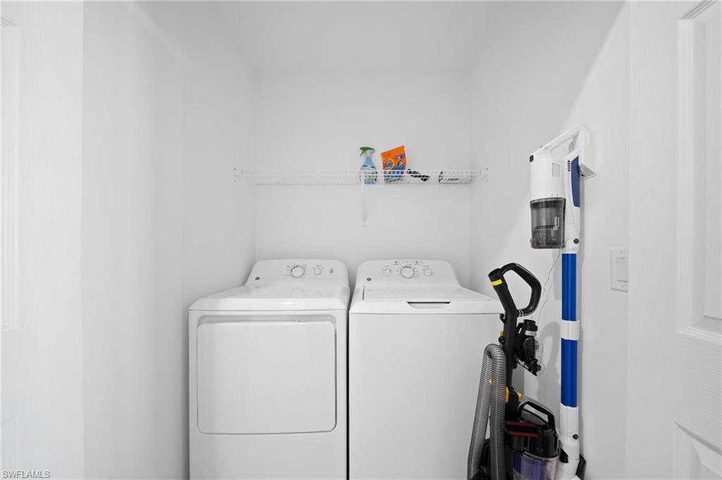 43997 Boardwalk Loop, Unit 1837 Babcock Ranch, FL 33982 - Photo 20 of 26 a utility room with dryer and washer