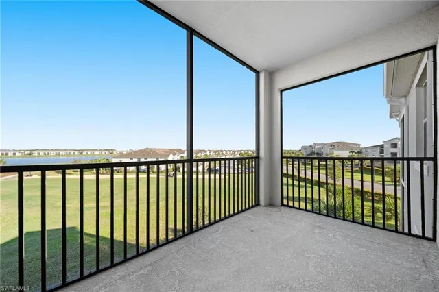 a kitchen with stainless steel appliances granite countertop a sink a stove a refrigerator and microwave