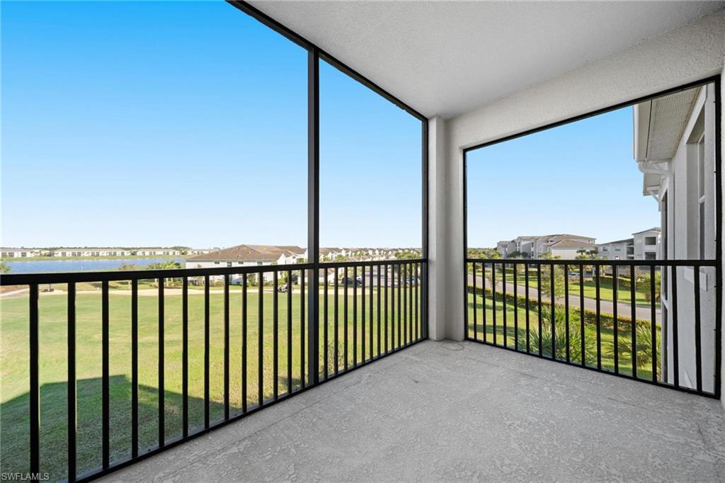 43997 Boardwalk Loop, Unit 1837 Babcock Ranch, FL 33982 - Photo 2 of 26 a view of a building from a balcony