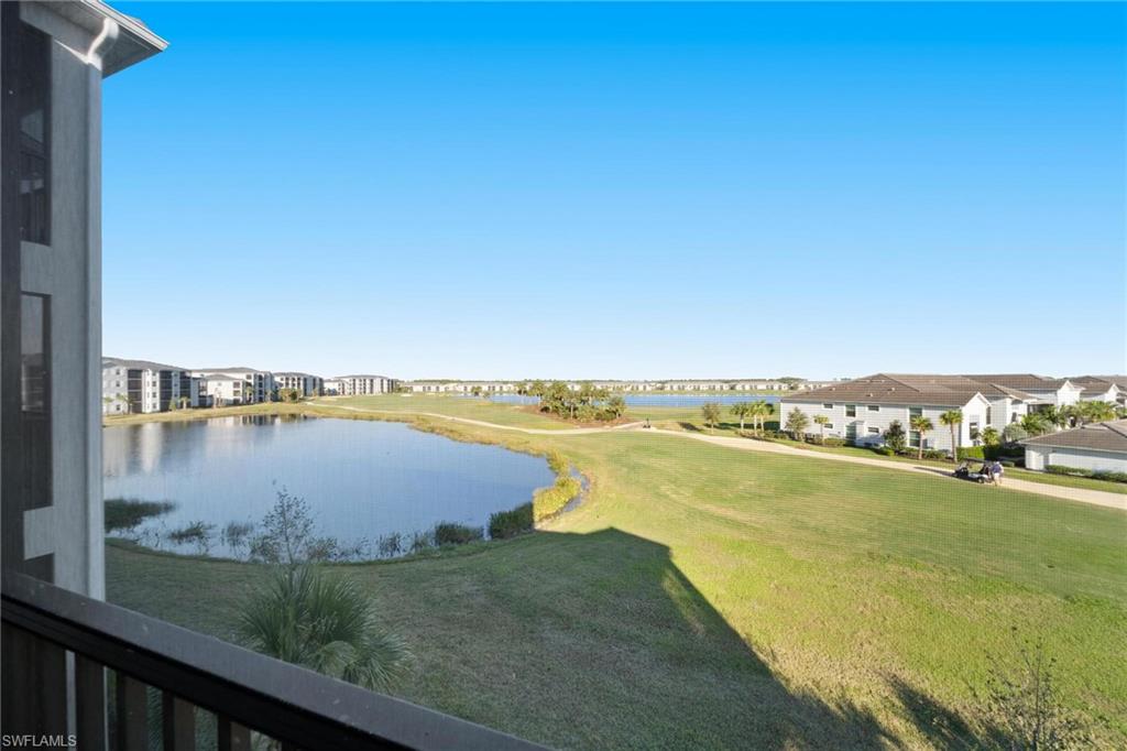 43997 Boardwalk Loop, Unit 1837 Babcock Ranch, FL 33982 - Photo 22 of 26 a view of a lake with a city view