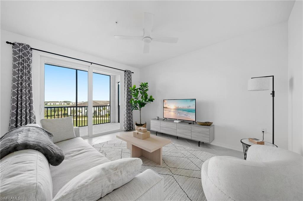 43997 Boardwalk Loop, Unit 1837 Babcock Ranch, FL 33982 - Photo 4 of 26 a living room with furniture and a window