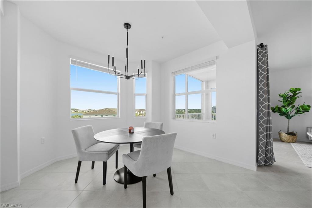 43997 Boardwalk Loop, Unit 1837 Babcock Ranch, FL 33982 - Photo 5 of 26 a dining room with furniture and window