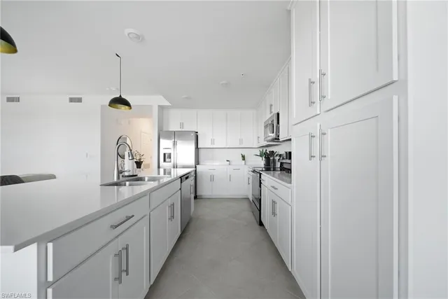 a very nice looking dining room with a large window