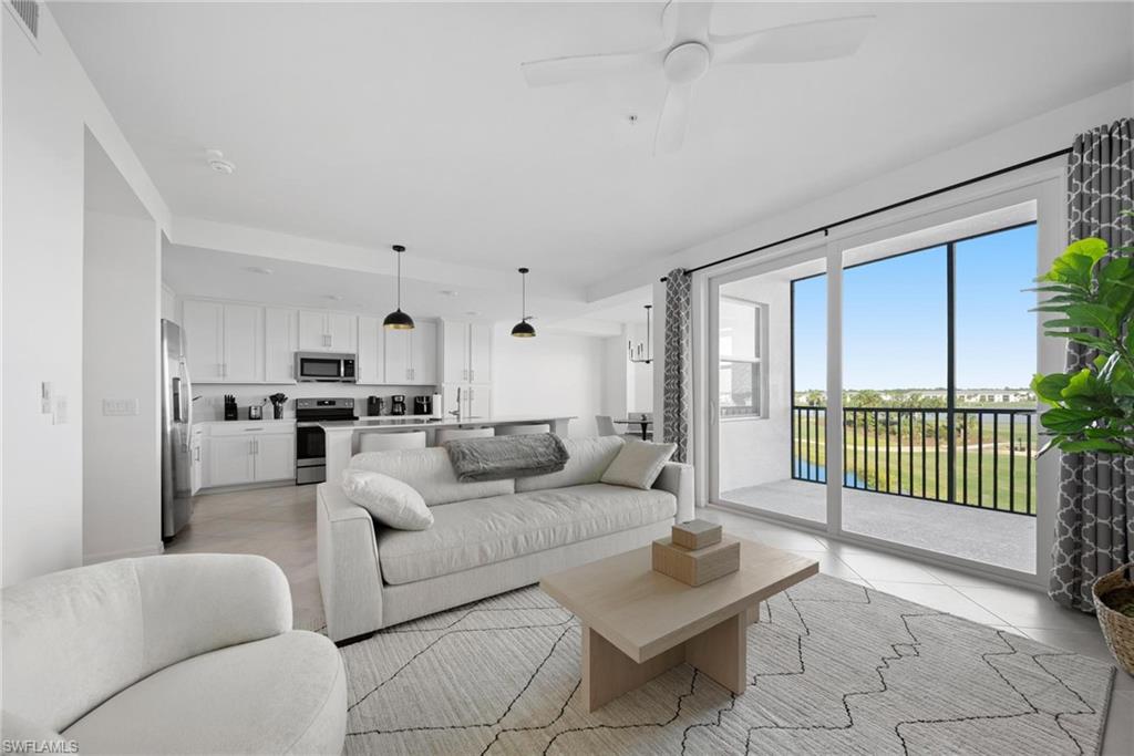 43997 Boardwalk Loop, Unit 1837 Babcock Ranch, FL 33982 - Photo 10 of 26 a living room with furniture and a large window