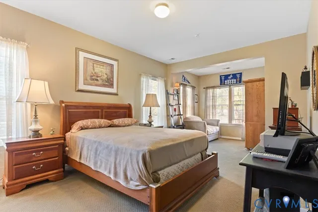 a bed room with a bed and a window