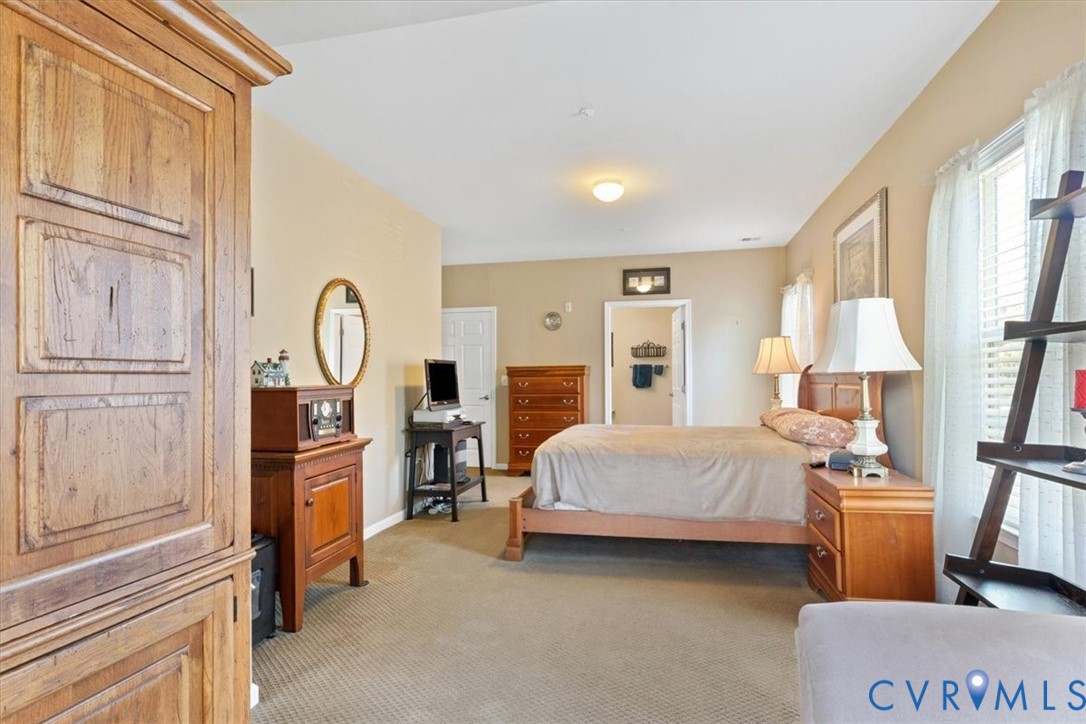 14011 Briars Circle, Unit 104 Midlothian, VA 23114 - Photo 15 of 22 a bed room with a bed and a window