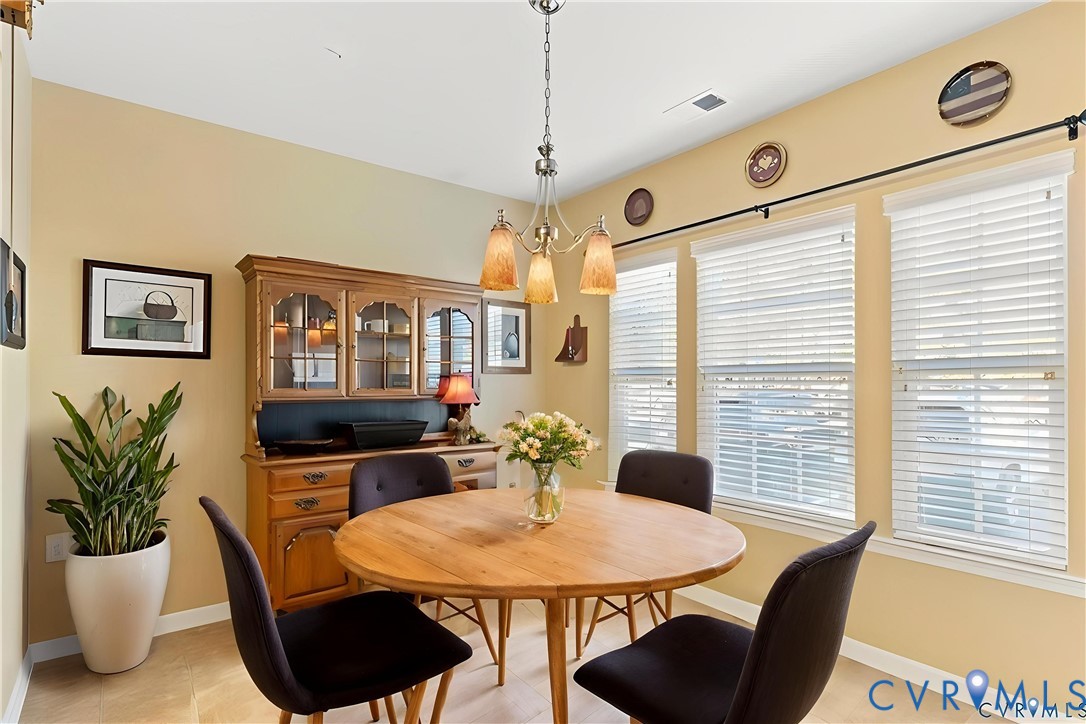 14011 Briars Circle, Unit 104 Midlothian, VA 23114 - Photo 3 of 22 a dining room with furniture and window