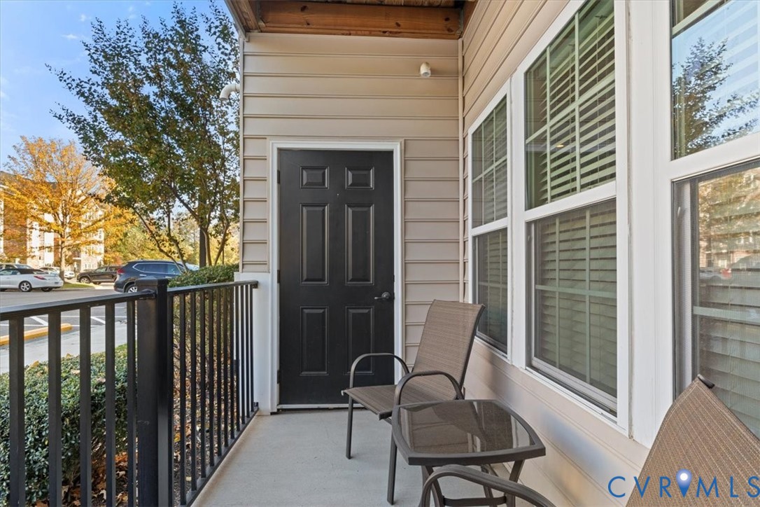 14011 Briars Circle, Unit 104 Midlothian, VA 23114 - Photo 5 of 22 a view of a balcony with furniture
