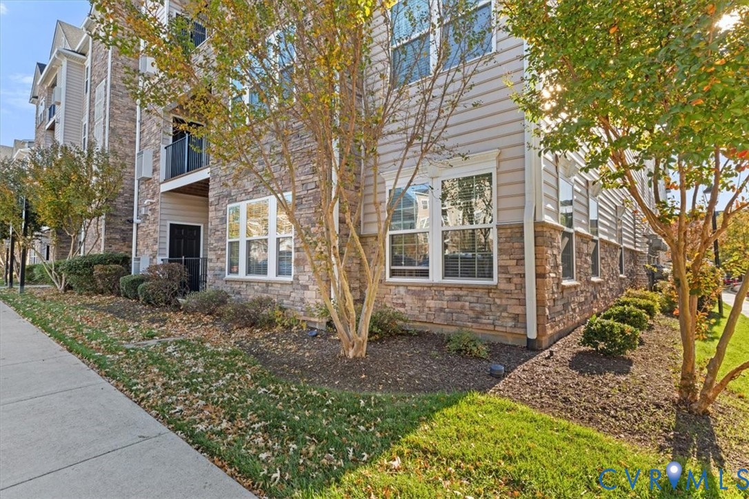 14011 Briars Circle, Unit 104 Midlothian, VA 23114 - Photo 6 of 22 a front view of a house with garden