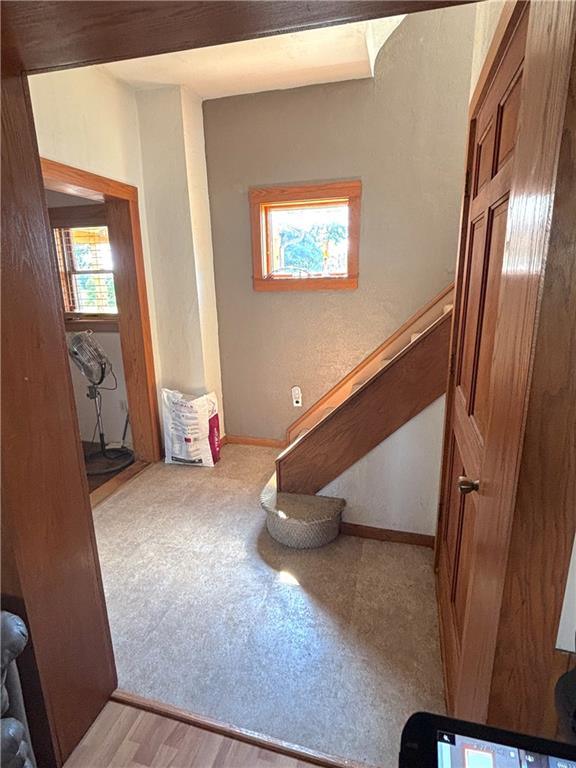 4217 Hillsville Road Pulaski, PA 16143 - Photo 16 of 26 a view of a livingroom with wooden floor and stairs