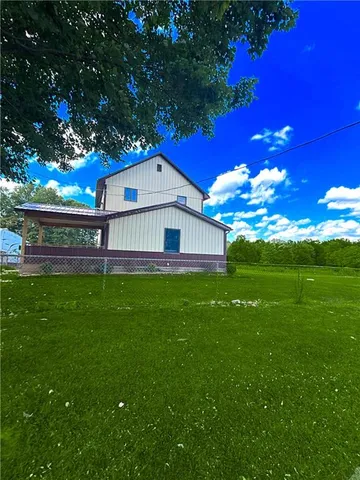 a view of a house with a big yard