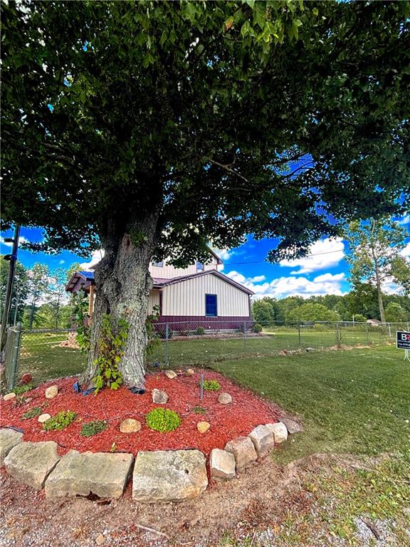 4217 Hillsville Road Pulaski, PA 16143 - Photo 3 of 26 a view of a yard with plants and large trees
