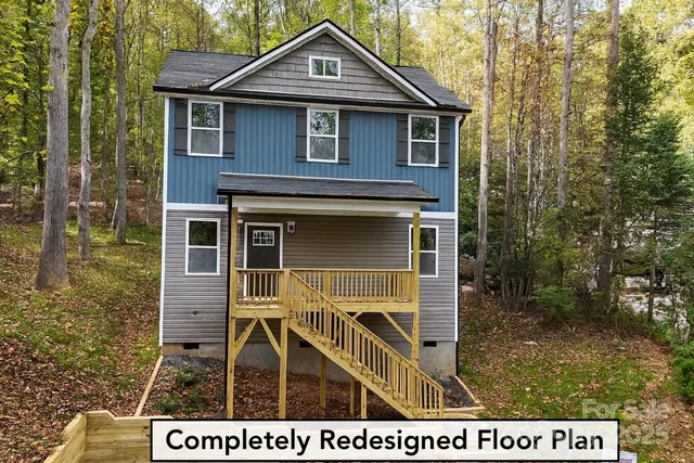 a view of a brick house with large windows