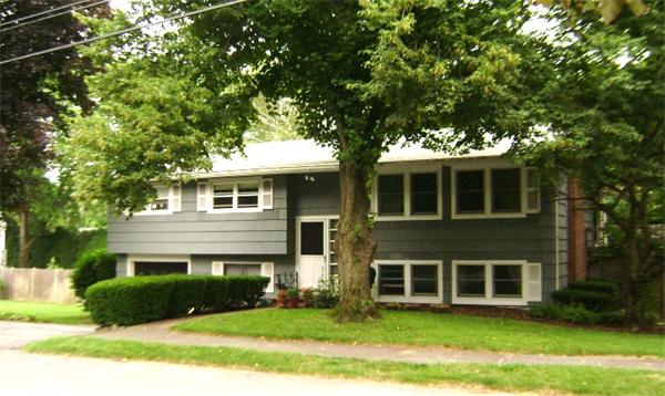172 Damon Road Needham, MA 02494 - Photo 1 of 14 a front view of a house with a yard and garage