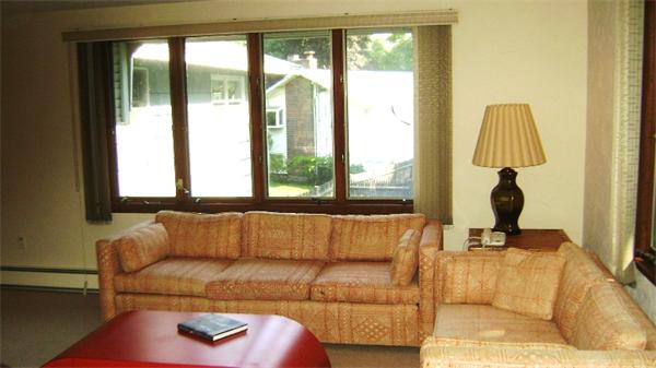 172 Damon Road Needham, MA 02494 - Photo 10 of 14 a living room with a couch and a large window