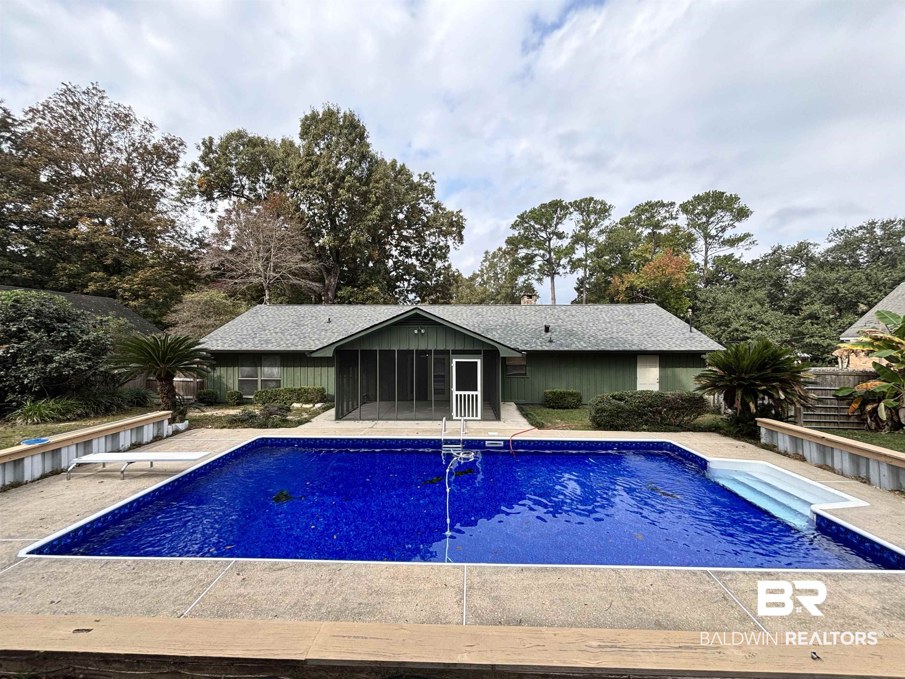 10 Soldiers Route Daphne, AL 36527 - Photo 3 of 26 Outdoor pool featuring a patio area, view of wooded area, and a diving board